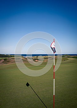 Golf flag on a golf green