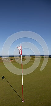 Golf flag overlooking the ocean