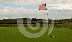 Golf flag in strong wind