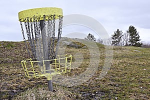 golf frisbee basket in early spring