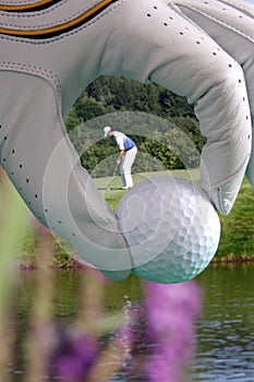 Golf glove with ball and with golfer