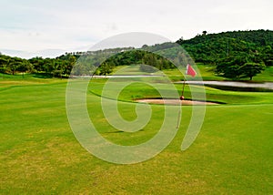 Golf green field with target flag 1