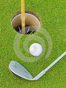 Golf hole with ball and putt