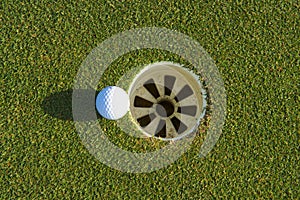 Golf hole on a field