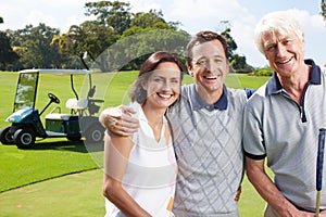 Golf is an important part of their relationship. Smiling golfing companions on the green with their golf cart in the