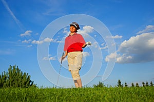 Golf, laughing woman golfer, with a stick and a ball in his hand
