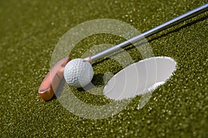 golf mallet on the green, artificial turf