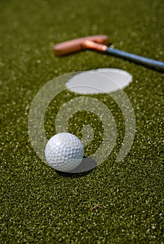 golf mallet on the green, artificial turf