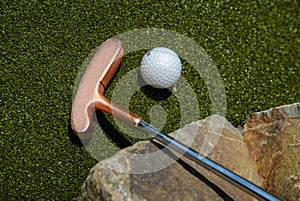 golf mallet on the green, artificial turf