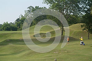 Golf player and caddie photo