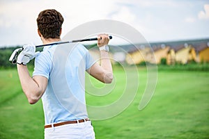 Golf player holding driver