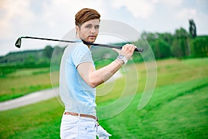 Golf player holding driver