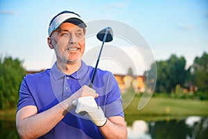 Golf player holding driver