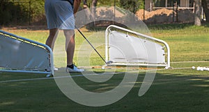 Golf player making a swing with a golf  fairway wood course