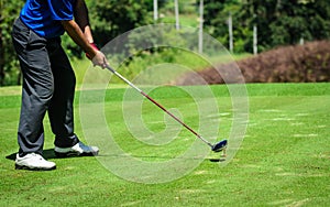 Golf player with putter