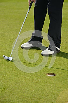 Golf player putting