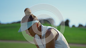 Golf player training course at country club. Sport woman hitting golfing ball.