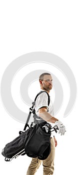 Golf player in a white shirt practicing, playing isolated on white studio background