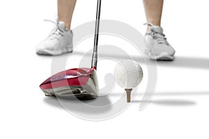 Golf player with wood golf club ready to hit the ball