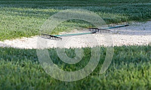 Golf sand bunker on pathway side in a court in palma de mallorca photo