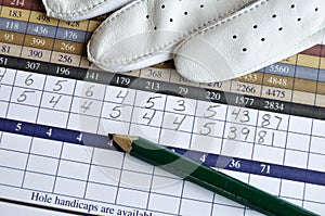 Golf Score Card with Glove and Green Pencil