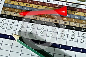 Golf Score Card with Red Tee and Green Pencil