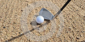 Golf shot from sand bunker golfer hitting ball from danger