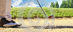 Golf shot from sand bunker golfer hitting ball from hazard