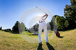 Golf sport: golfer hits a shoot from the fairway