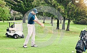 Golf, stroke and hobby with a sports man swinging a club on a field or course for recreation and fun. Golfing, grass and