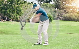 Golf, stroke and motion blur with a sports man swinging a club on a field or course for recreation and fun. Golfing