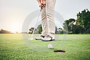 Golf stroke, sport putt and golfer hands in game, fitness and exercise on grass with a swing. Athlete, lens flare and