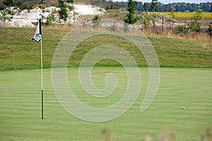 Golf tournament - golf balls and flag