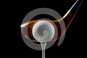 Golf wooden club with ball on tee