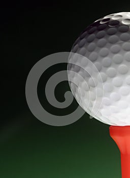 Golfball on red tee