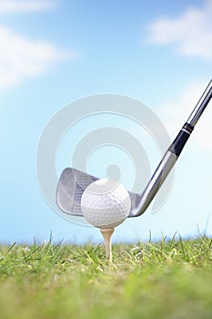 Golfball On Tee With Golf Club