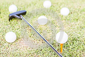 golfclub and golfball on grass. photo