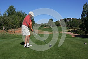 Golfer addressing ball