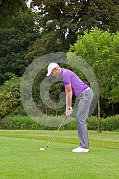 Golfer addressing the ball