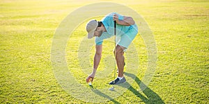 golfer in cap with golf club hold ball, sport game