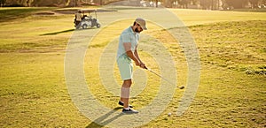 golfer in cap with golf club play on grass, sports