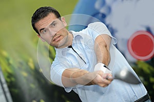 golfer finishing driver swing photo