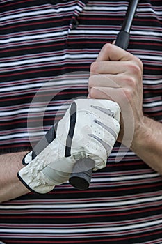 Golfer with Glove Holding Club