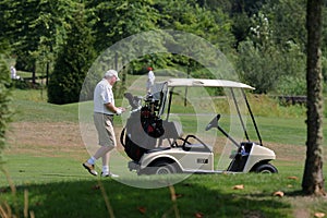 Golfer and golf cart