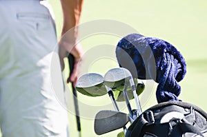 Golfer with golf clubs in bag