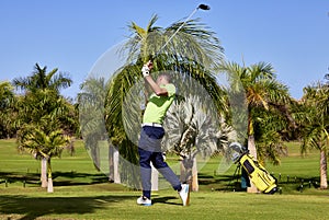 Golfer on a golf course, ready to tee off