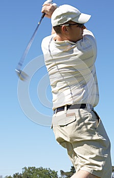 Golfer hitting the ball