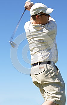 Golfer hitting the ball