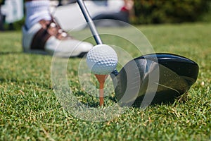 Golfer Hitting Golf Ball off Tee