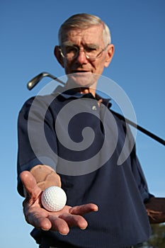 Golfer Holding Ball